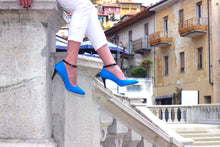 Shoes modeled on stairs of Cathedral in Monforte d'Alba Piedmont, Italy