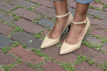 Nude Napa Leather Ankle Strap Mid Heel (70mm) modeled on antique brick streets in Houston, Texas.